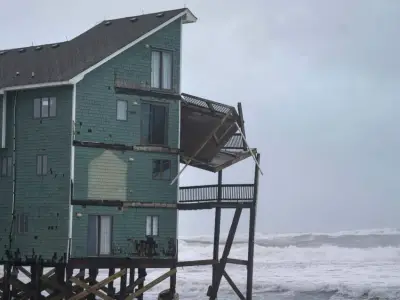 Dozens rescued as remnants of typhoon hits Alaska while nor’easter brings flooding to East Coast