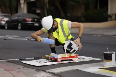 Activists paint Westwood crosswalk to improve safety. Police shut down effort, cite volunteer for vandalism