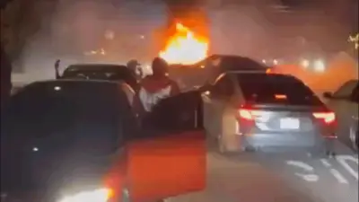 Video shows wild neighborhood street takeover as violent mob pummels couple, burns truck