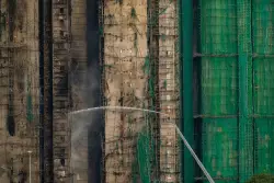 Fire that killed at least 44 burns in Hong Kong towers for a second day